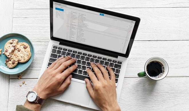 aerial-view-man-using-computer-laptop-wooden-table-jpg