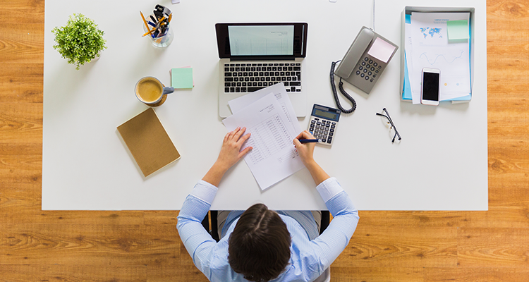 businesswoman-with-tax-report-at-office-2021-08-26-22-49-45-utc