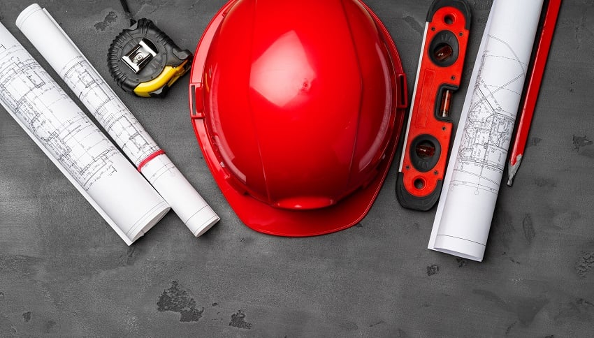 construction-worker-hardhat-blueprints-and-const-2021-12-09-11-14-49-utc