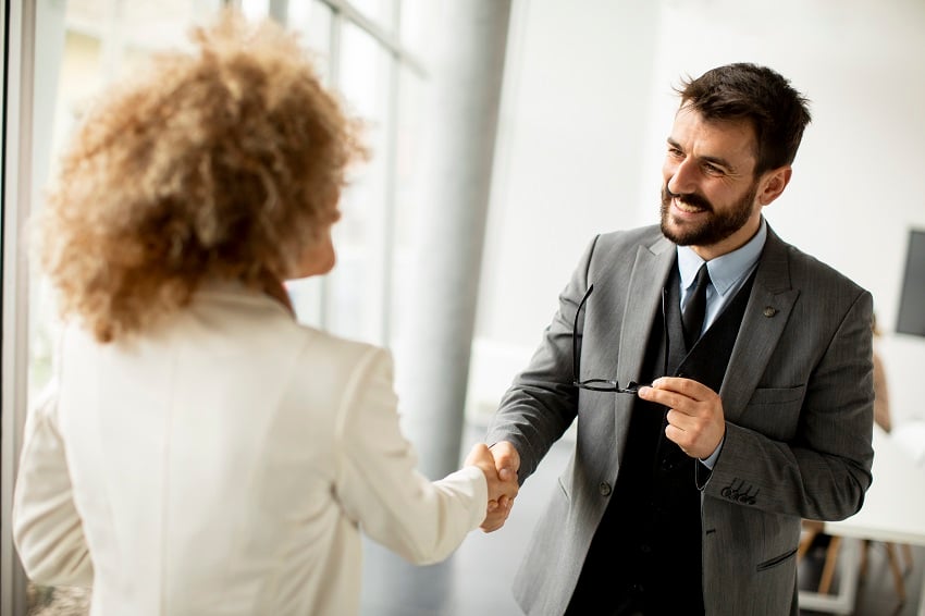 couple-of-multiethnic-business-people-handshaking-2022-04-05-23-41-01-utc