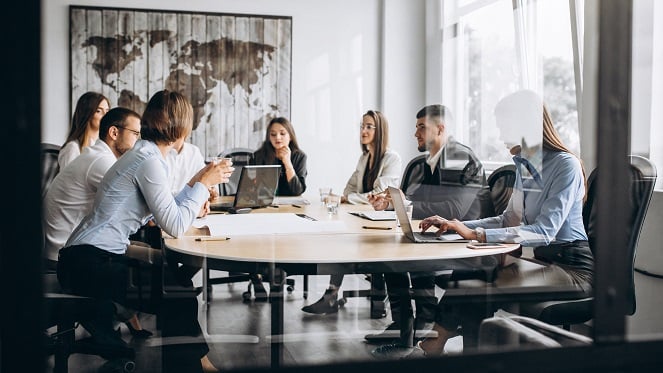 group-people-working-out-business-plan-office