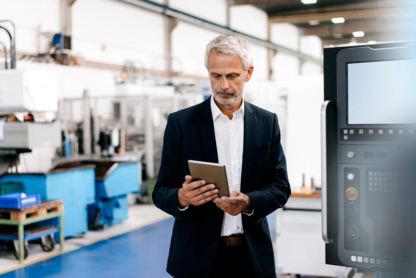manager-using-digital-tablet-in-high-tech-company-2022-12-16-22-26-18-utc