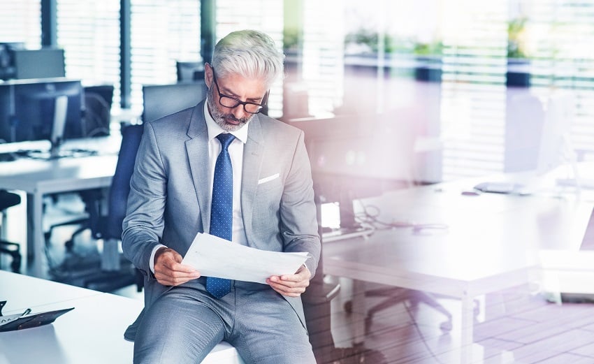 mature-businessman-in-gray-suit-in-the-office-2022-02-02-05-05-52-utc