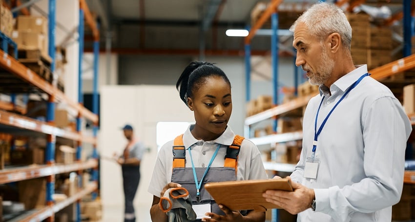 mature-foreman-and-black-female-worker-using-touch-2022-11-29-22-44-05-utc