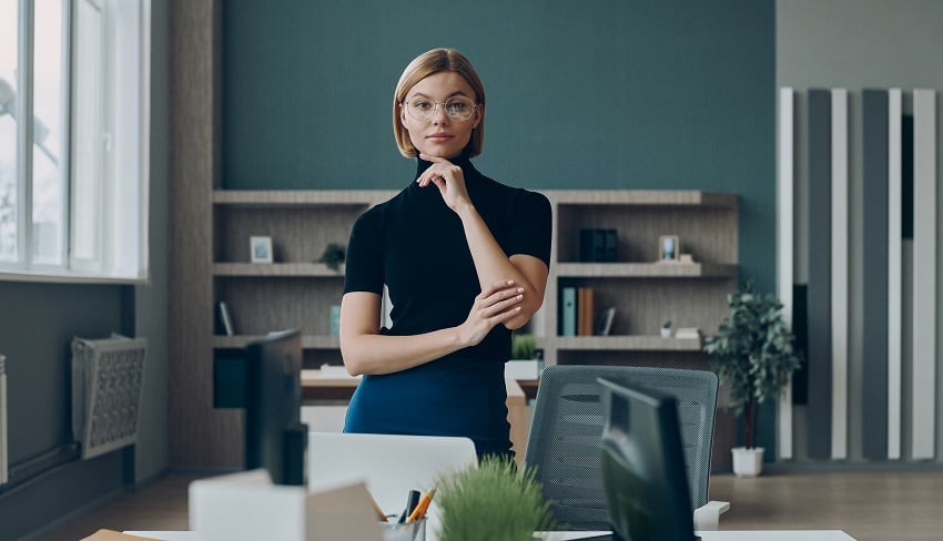 serious-businesswoman-looking-at-camera-while-stan-2023-03-27-20-02-33-utc