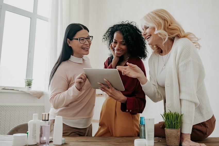 three-happy-mature-women-choosing-beauty-products-2023-05-11-03-48-20-utc