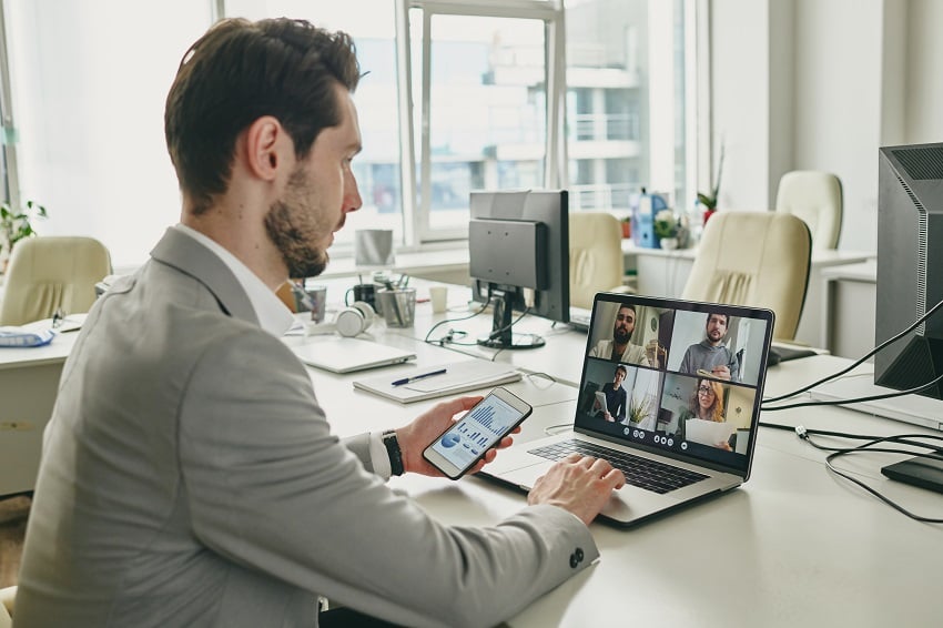 young-businessman-communicating-with-clients-onlin-2022-02-02-03-56-51-utc