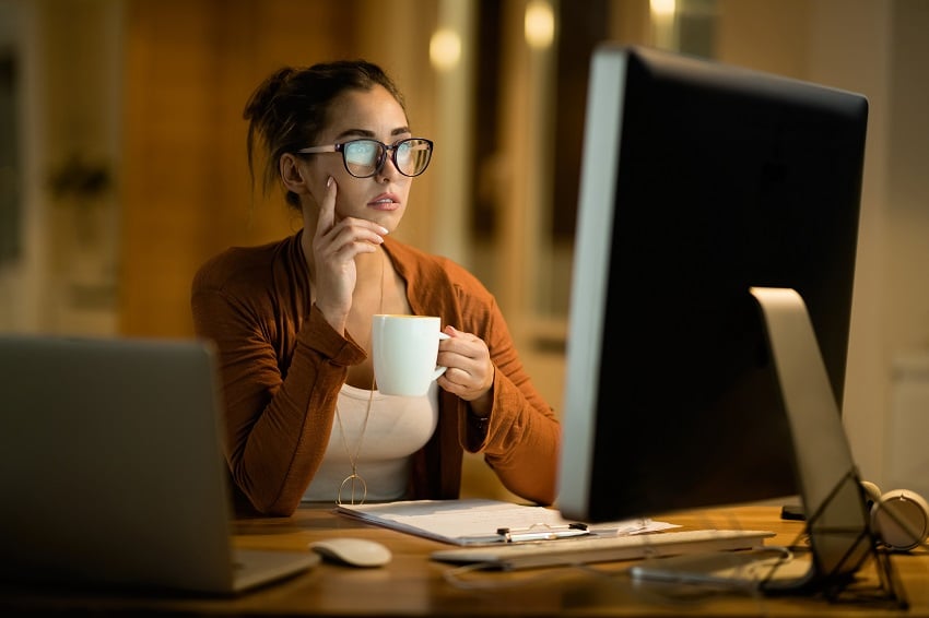 young-pensive-woman-drinking-tea-while-reading-e-m-2022-09-23-23-06-01-utc